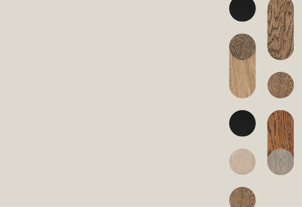 Colorful wood samples placed vertically on a green background.