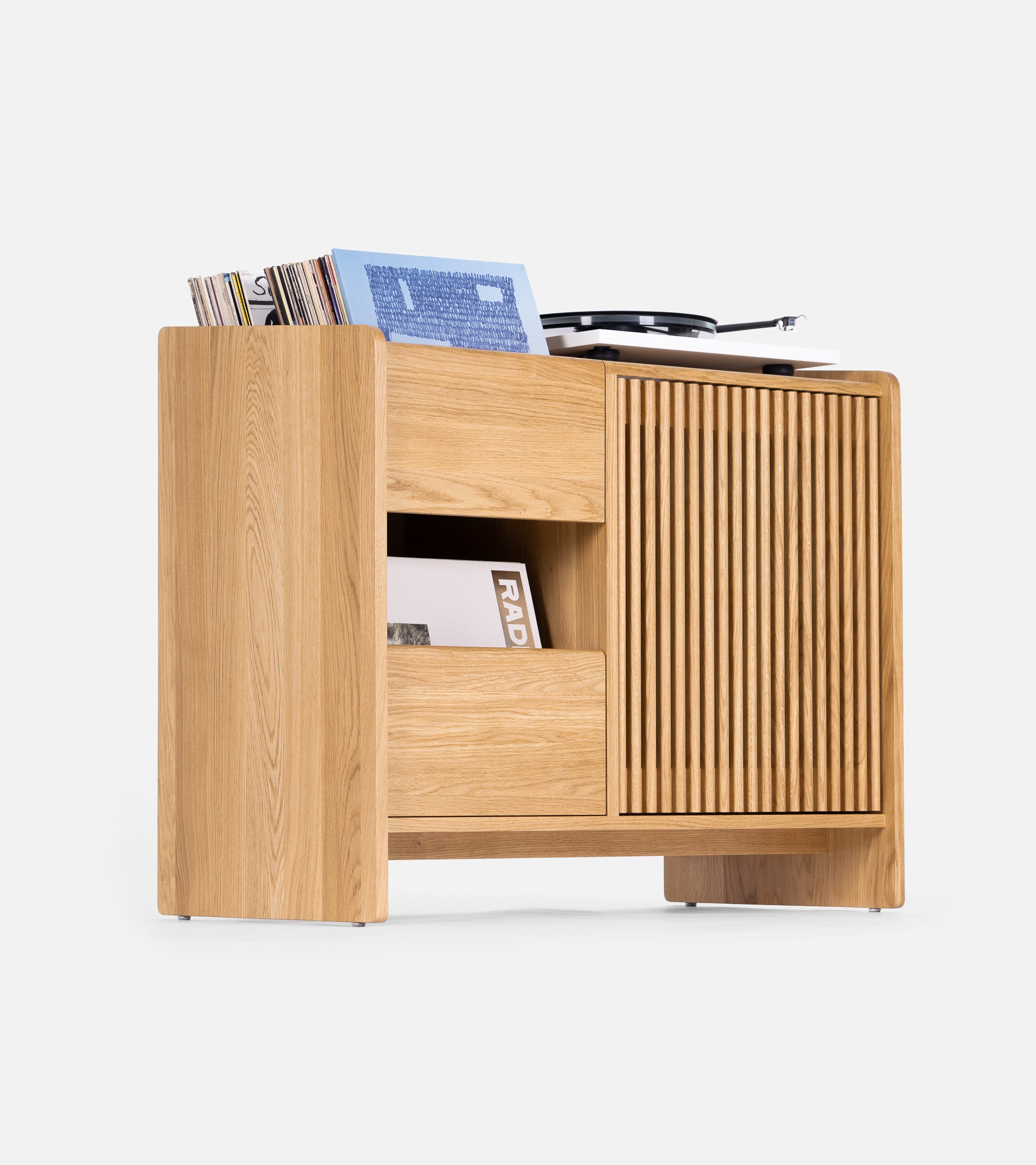 A wooden record player cabinet with shelves and a compartment holding vinyl records and a turntable on top.