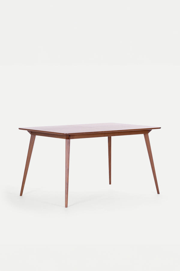 A wooden rectangular table with tapered legs on a white background.
