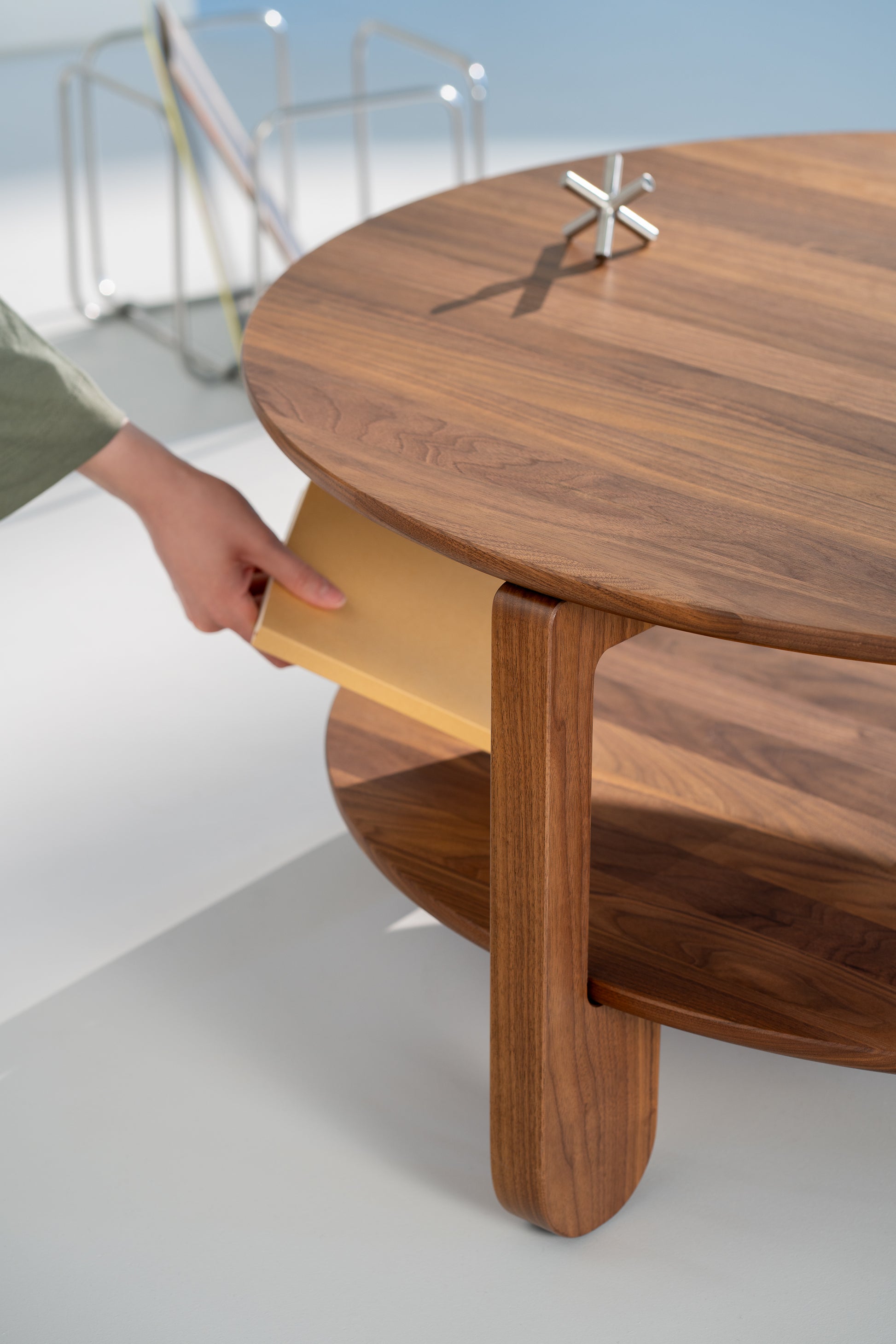 Close-up of the NOON table edge showing the hand-finished oil-wax surface on walnut
