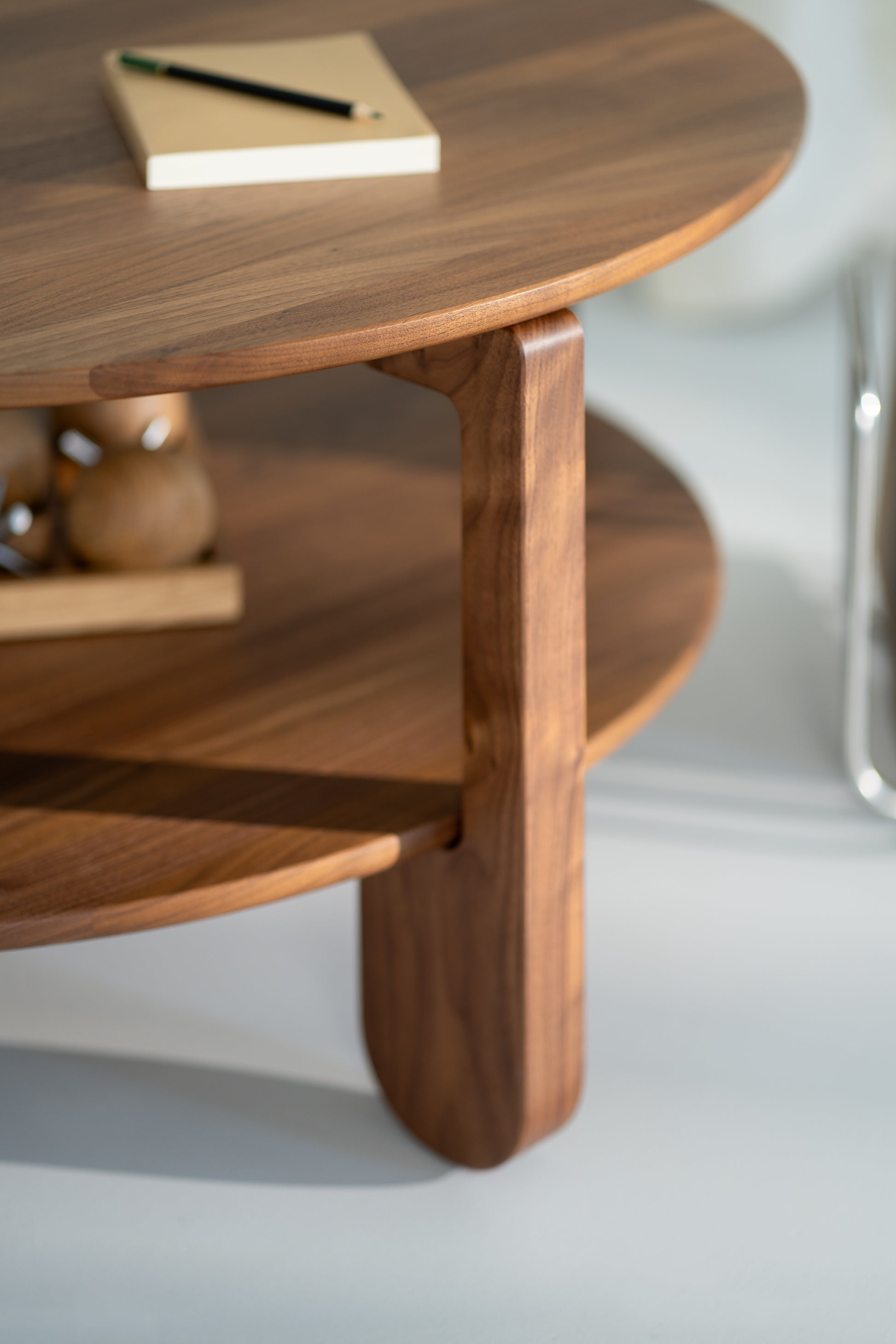 Top view of the NOON walnut coffee table showing natural grain pattern and oil-wax finish