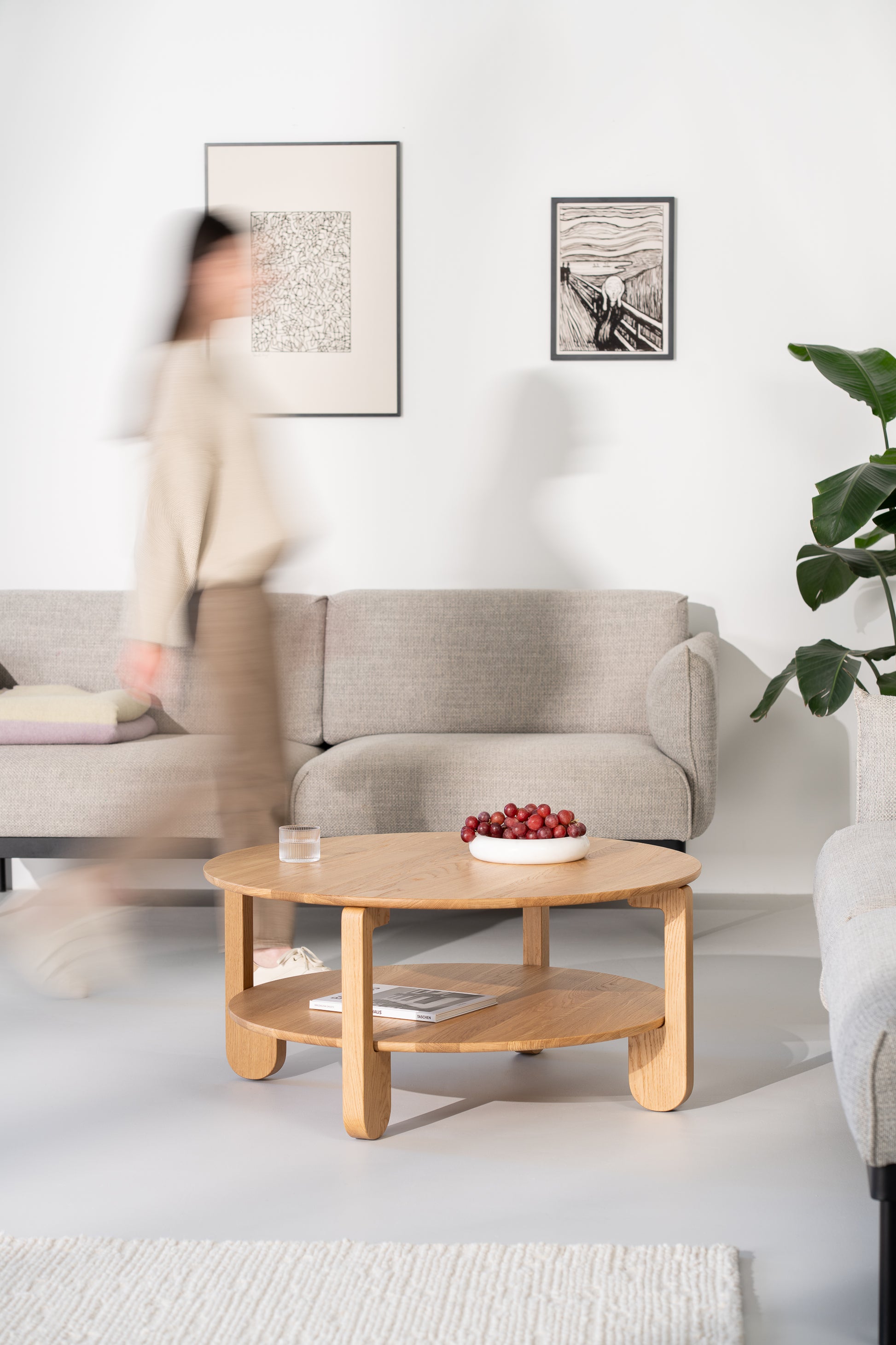 NOON oak coffee table placed in a living room on a light rug near a sofa