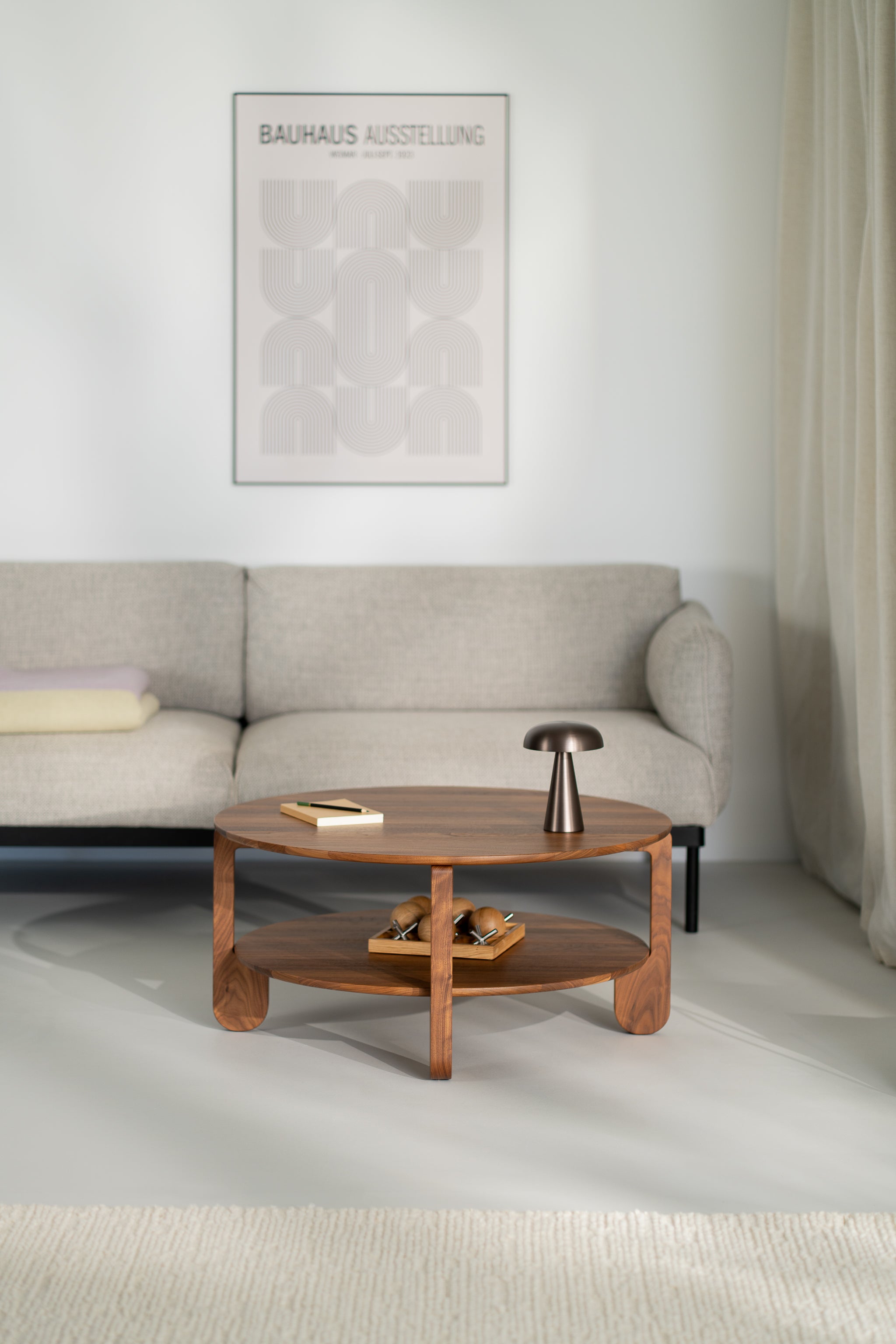 Close-up of American walnut surface on the NOON round table with visible wood grain detail
