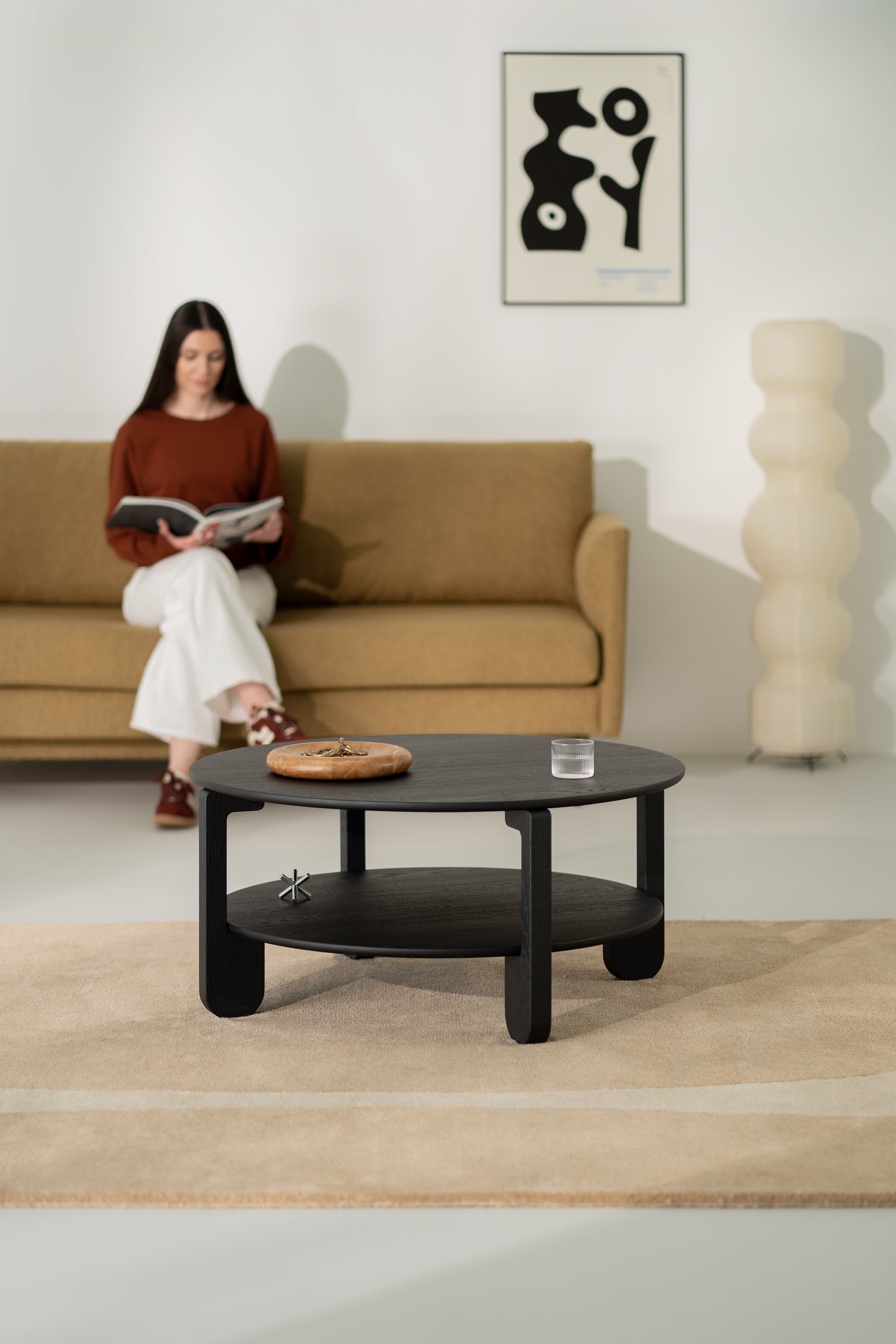 Close-up of softly rounded edge detail on the black solid oak NOON table