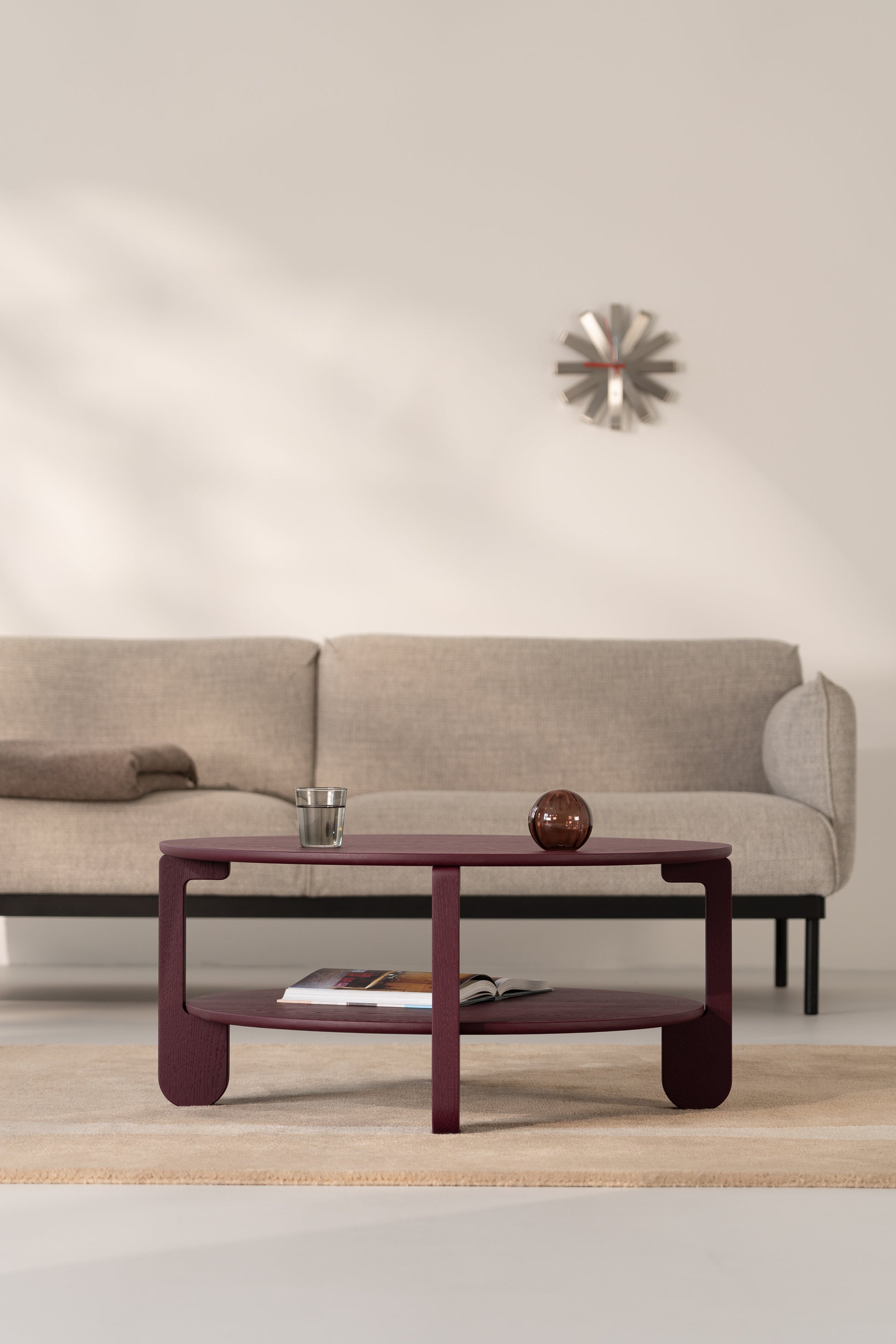 Close-up of the burgundy matte finish on the NOON solid oak coffee table surface
