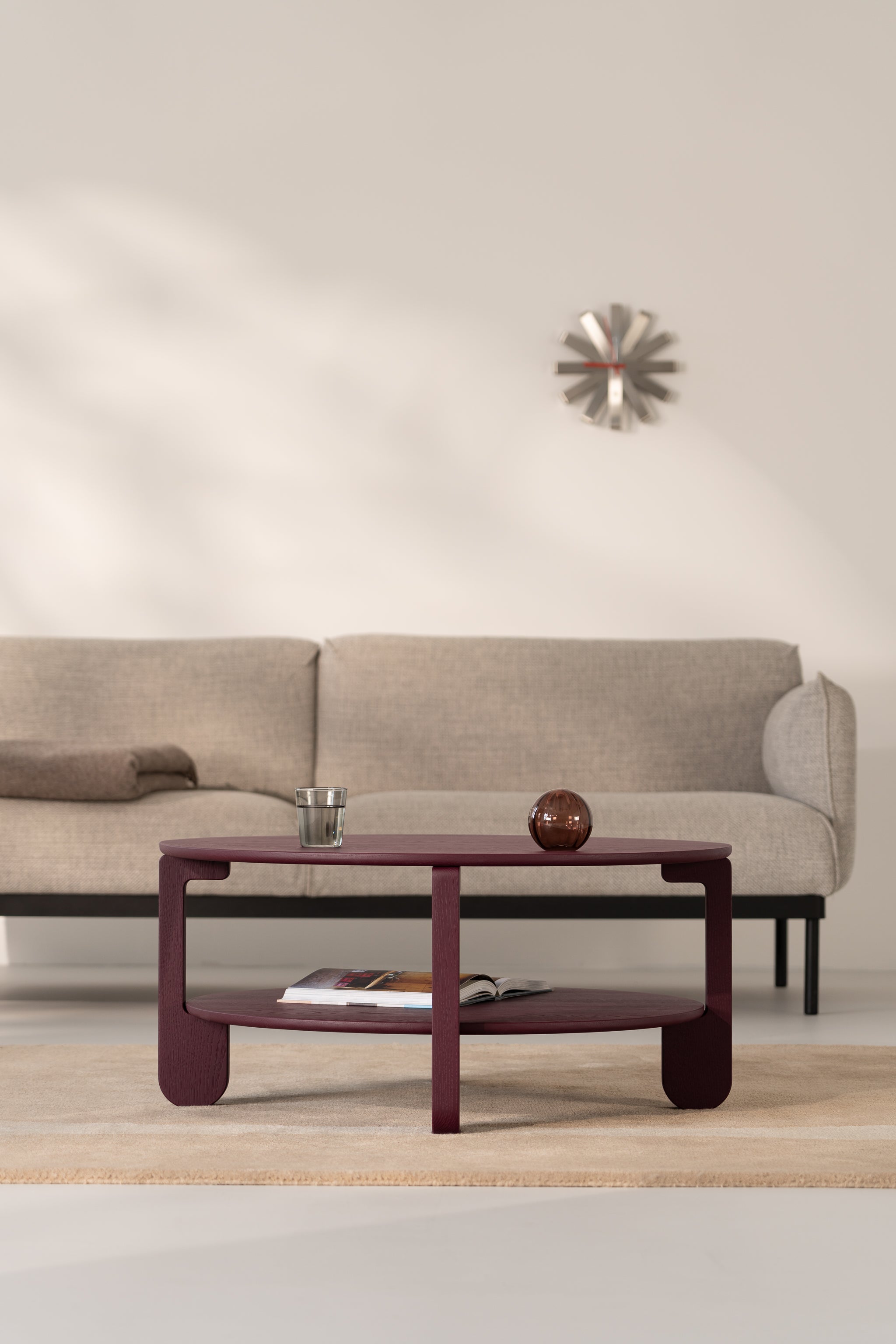 Close-up of the burgundy matte finish on the NOON solid oak coffee table surface