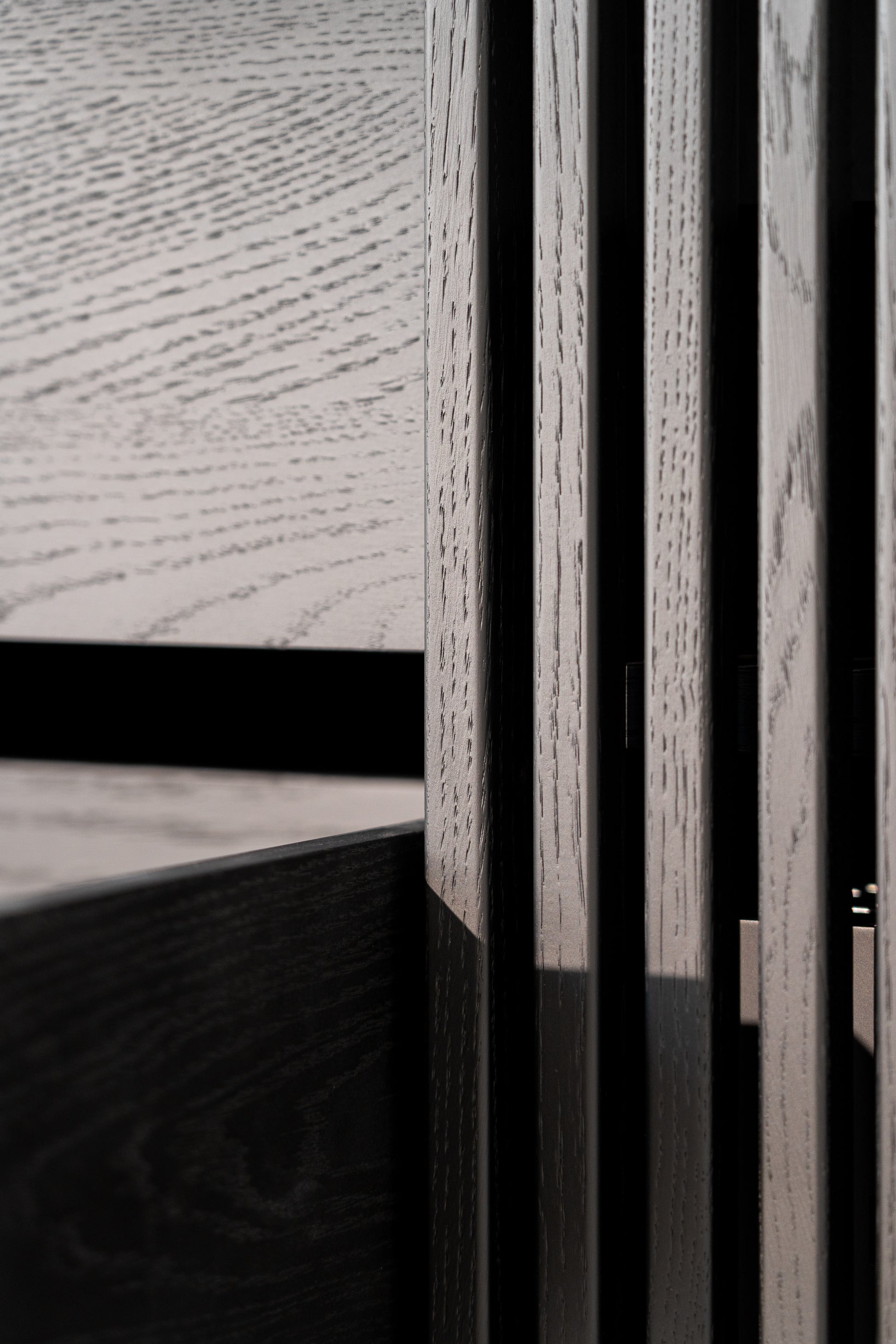 Close-up of textured wood paneling with varying shades and grain patterns.