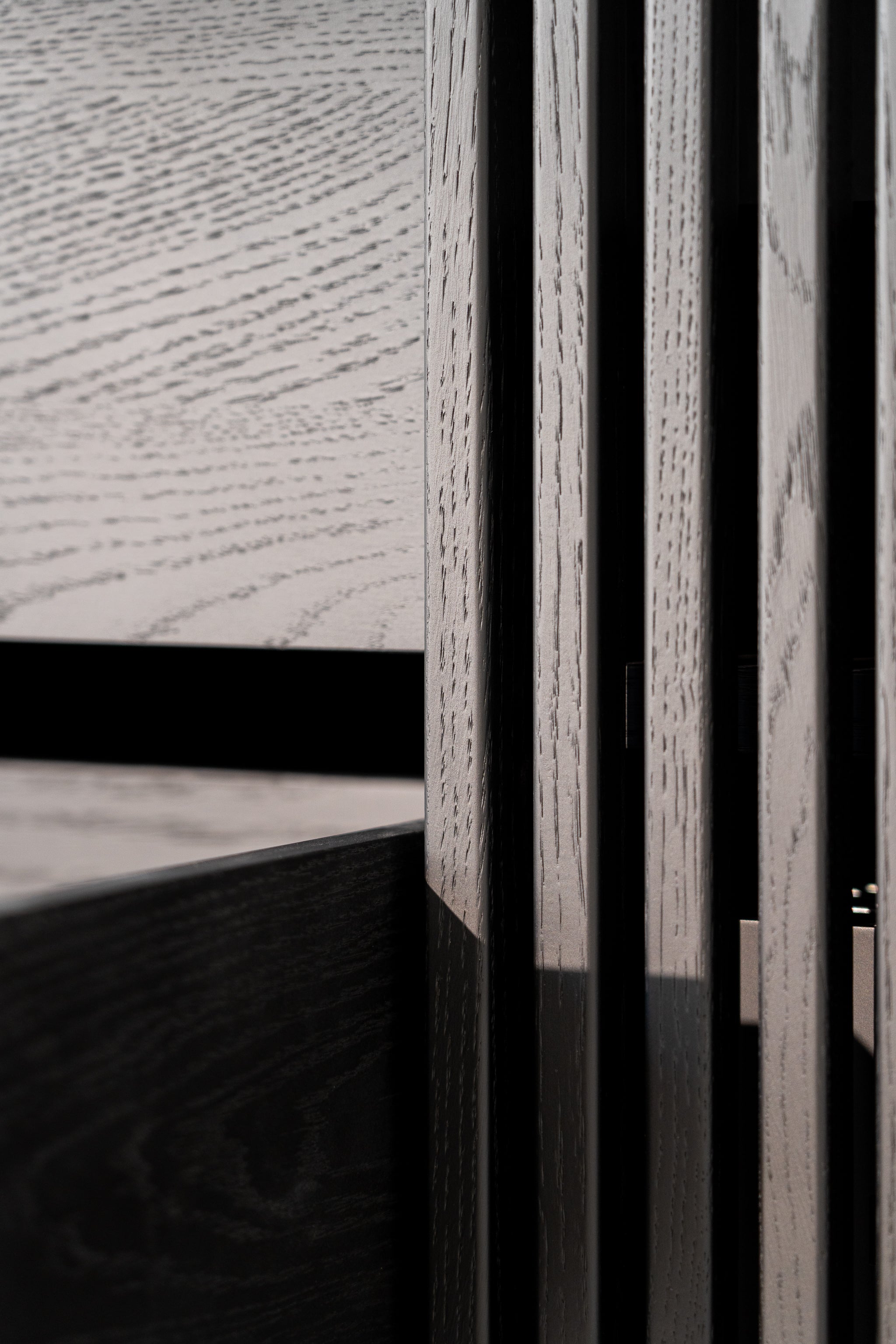 Close-up of textured wood paneling with varying shades and grain patterns.
