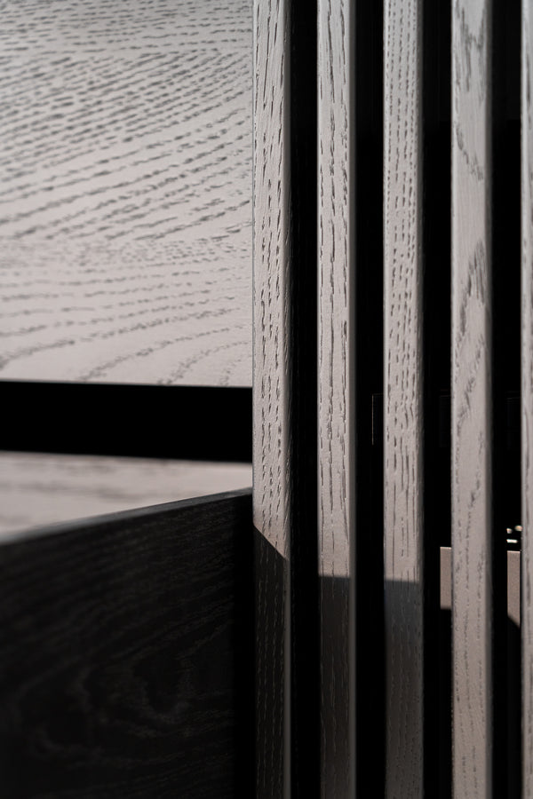 Close-up of textured wood paneling with varying shades and grain patterns.
