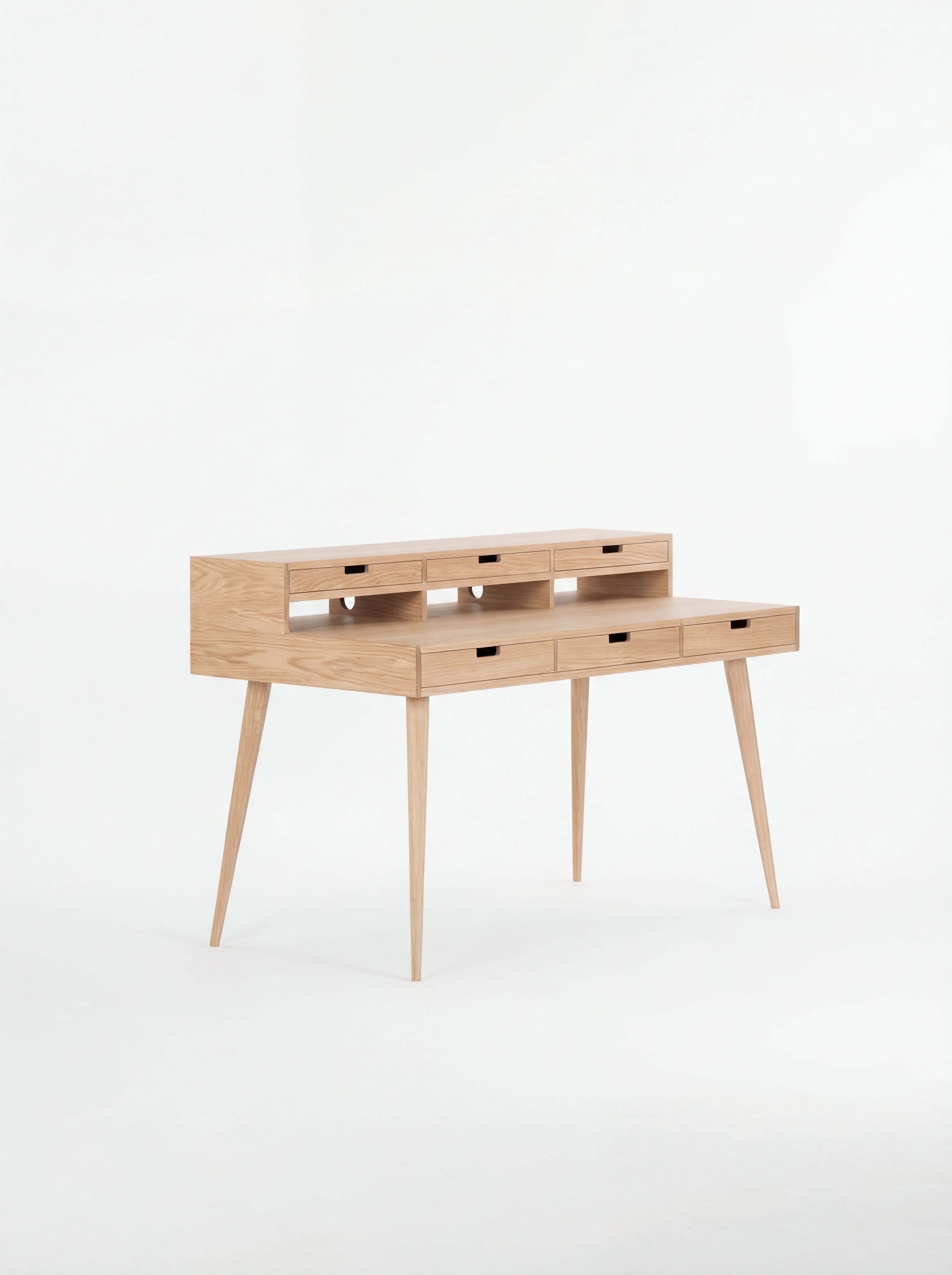 Wooden writing desk with slim legs and multiple drawers, set against a white background.
