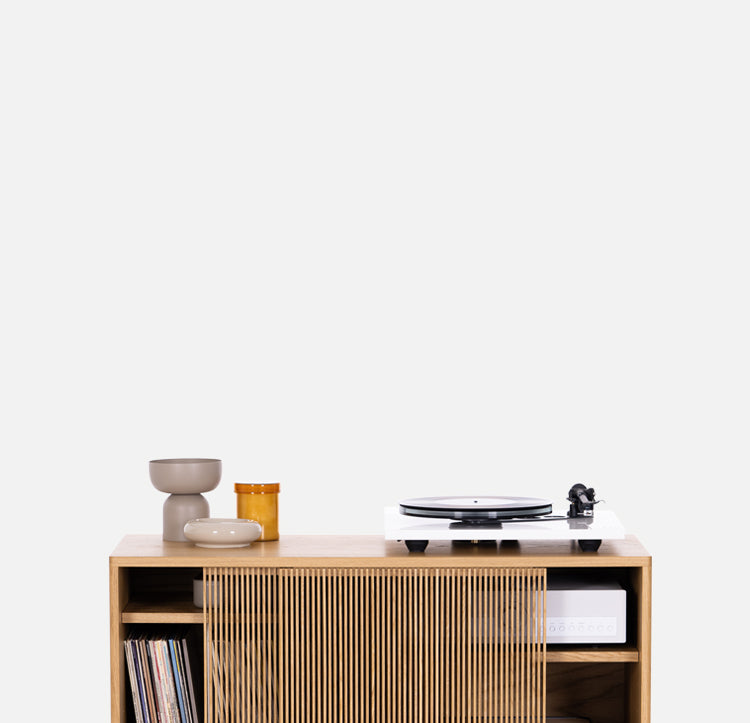 Solid oak cabinet with sliding fronts on a white background. Audio Cabinets