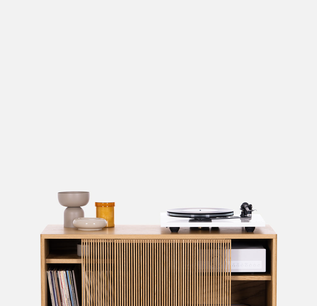Solid oak cabinet with sliding fronts on a white background. Audio Cabinets