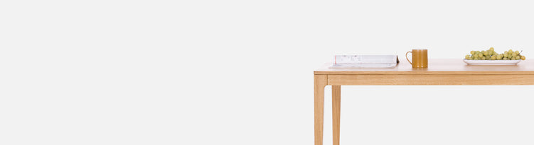 Solid oak wood table on a white background. Solid wood dining tables