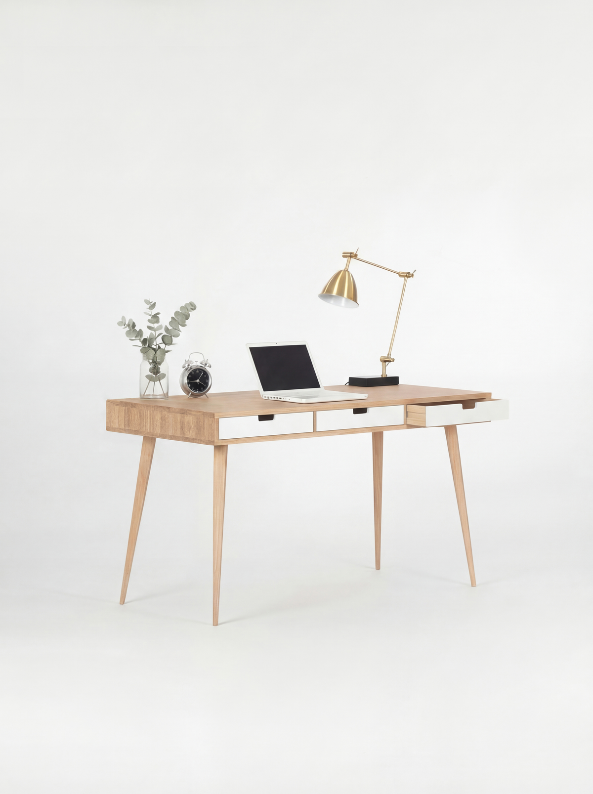 HEIM 140 desk in solid oak with three white drawer fronts, the right drawer open and a laptop on top