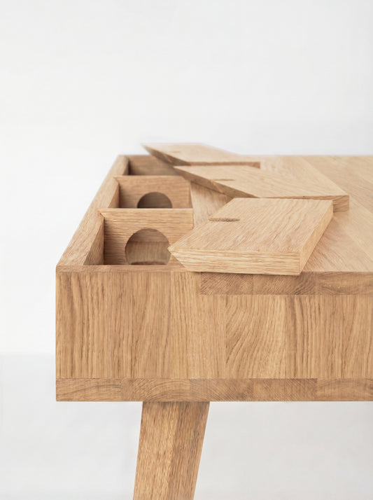 HEIM 140 desk in solid oak, back corner detail with raised cable flaps, round holes and joined strips at the edge