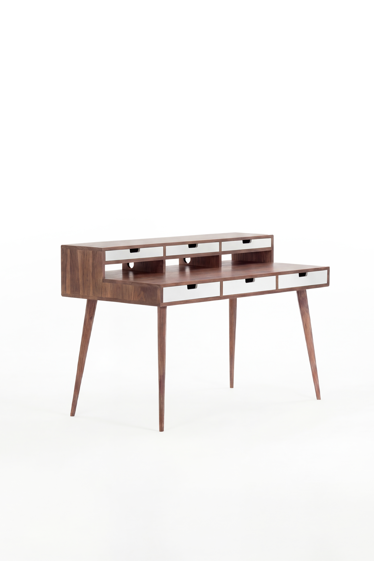 HEIM 140 desk in solid walnut, three-quarter view with six white drawer fronts and an empty top