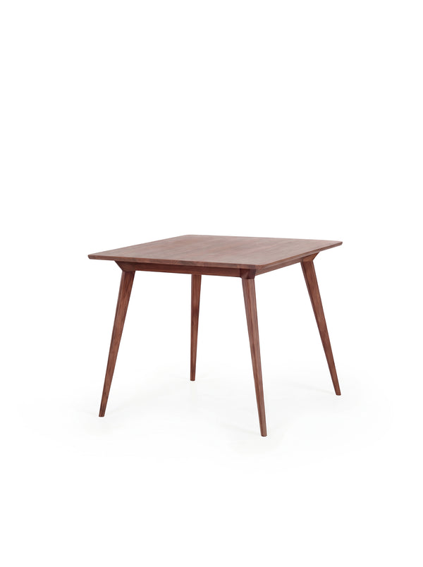 Wooden table with tapered legs.