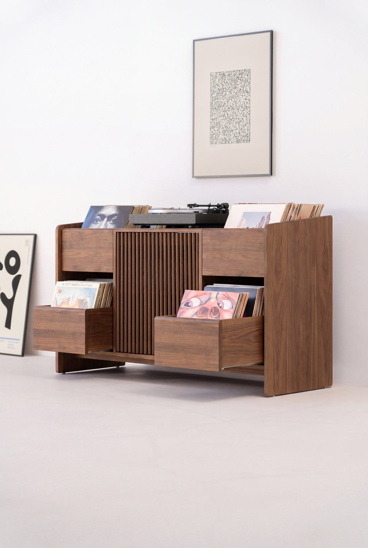 FUSE X in solid walnut at a three-quarter angle, both side drawers extended and filled with records
