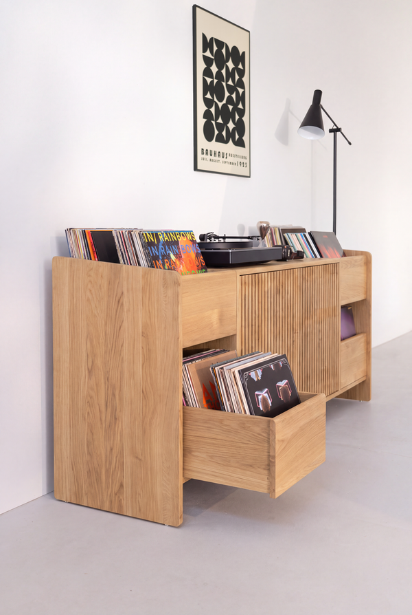 FUSE XX in solid oak seen from one end, with a drawer full of records pulled out and the side panel reaching the floor