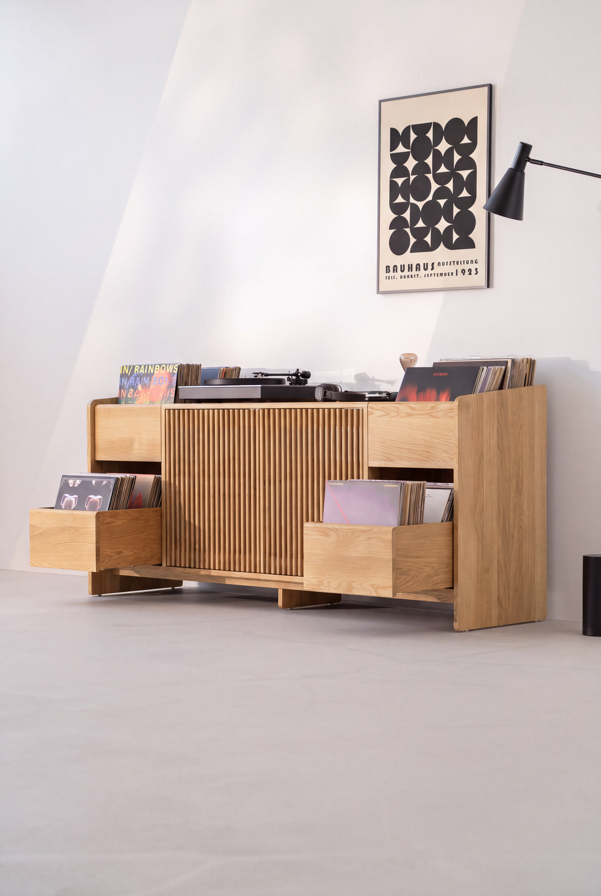 Angled view of the FUSE XX in solid oak with both side drawers pulled out and full of records