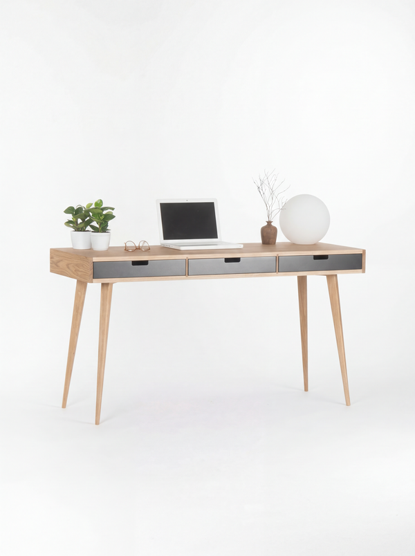 HEIM 140 desk in oak wood, full view with black fronts, splayed legs, laptop, plants and globe lamp