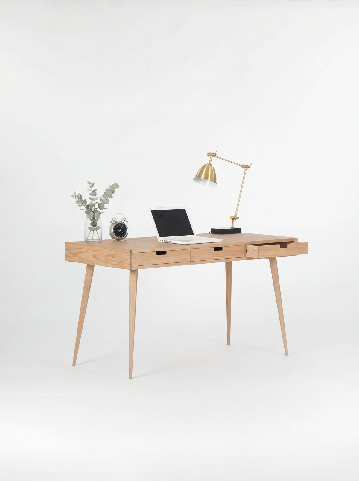 HEIM 140 home office desk with drawers in oak wood, angled view with the right drawer open and a laptop on top
