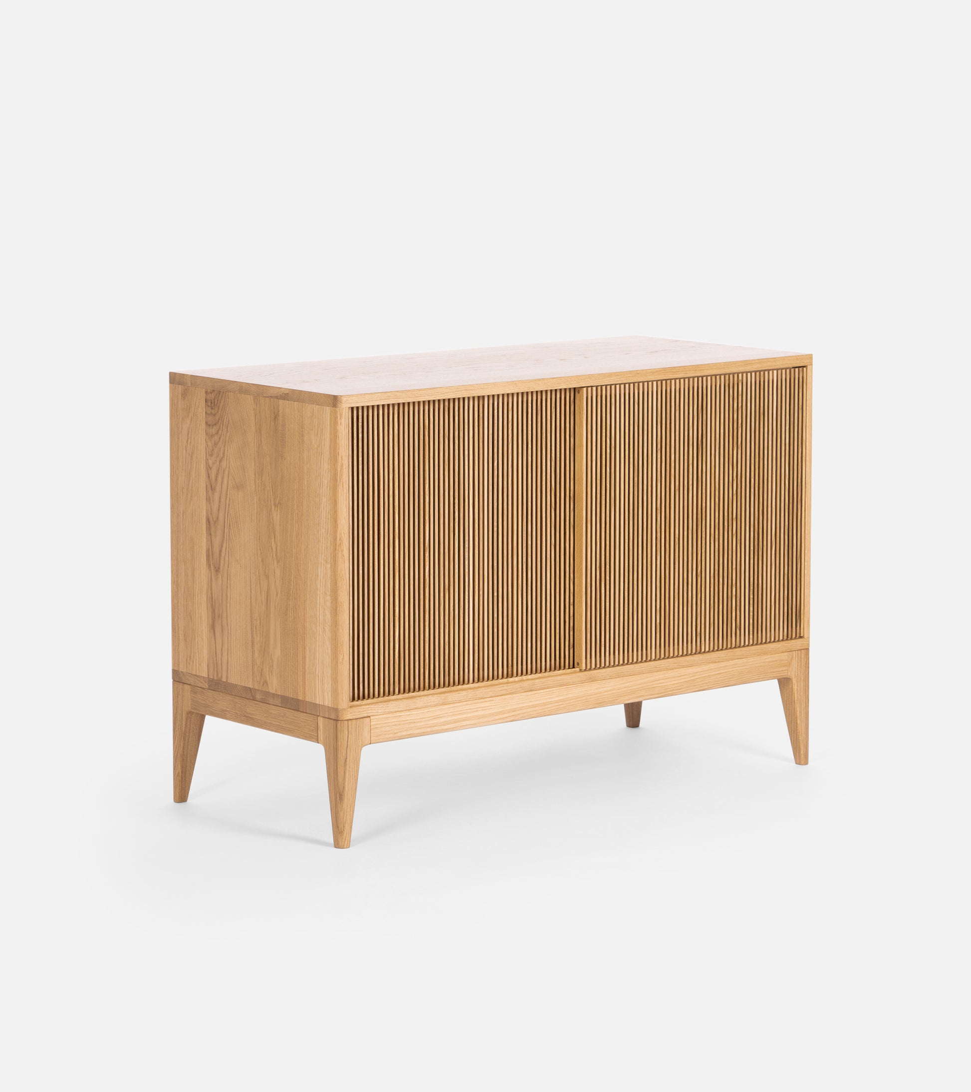 Wooden sideboard with slatted front doors and tapered legs.