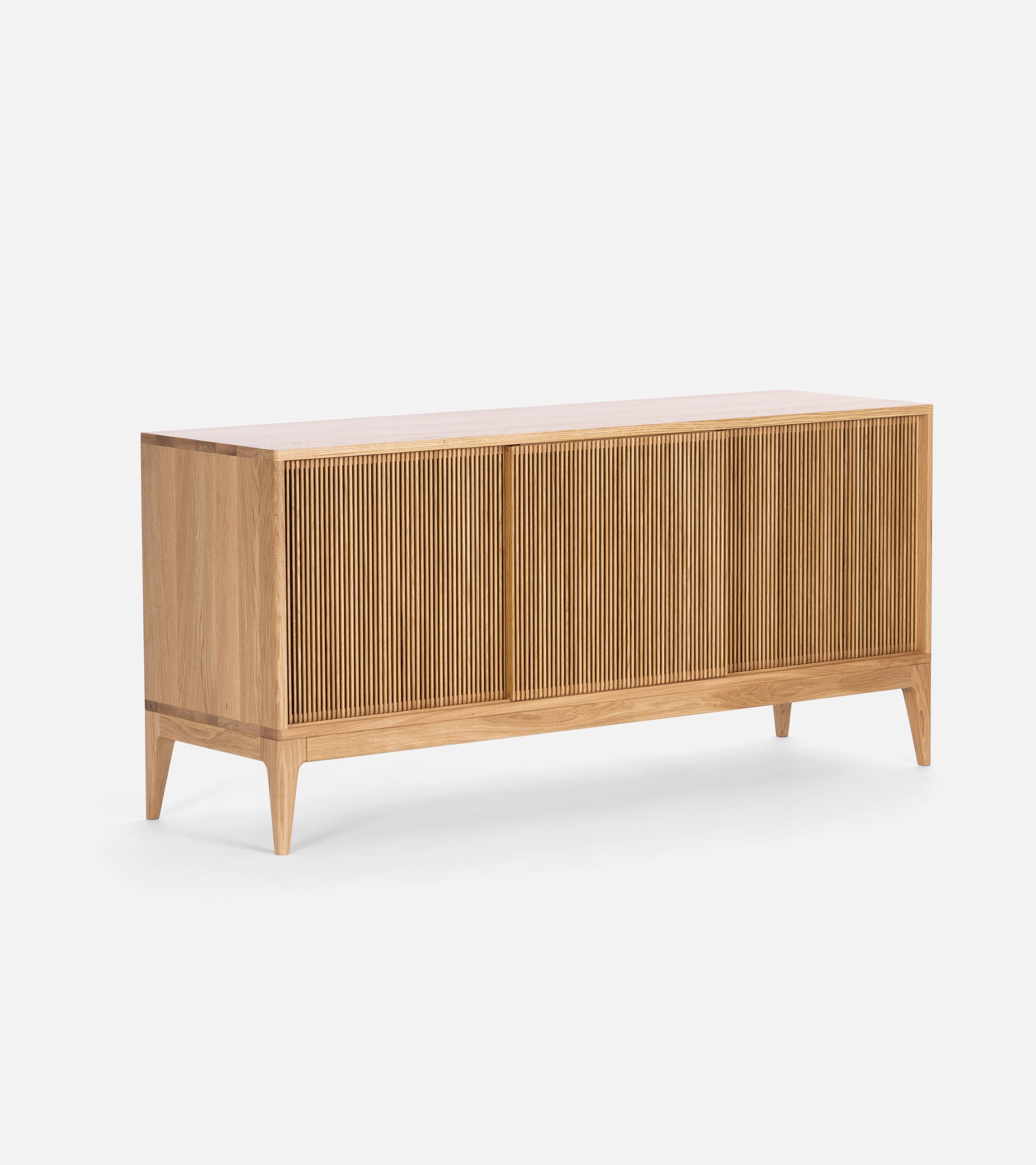 A wooden sideboard with slatted doors and tapered legs against a white background.