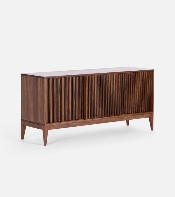 TONN 150 mid century record cabinet in solid American walnut, three-quarter studio view, three slatted sliding fronts closed