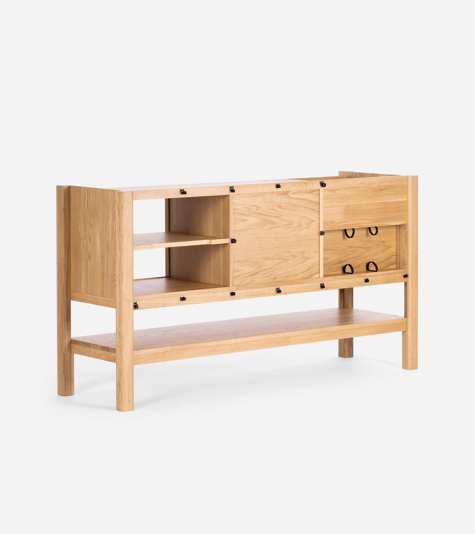 A wooden sideboard with open shelves, drawers, and black handle accents on a white background.