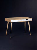 Empty HEIM 105 desk in solid oak with two white drawer fronts, seen at an angle against a dark background