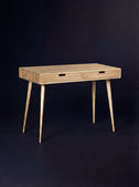 Empty HEIM 105 desk in solid oak, three-quarter view with wooden drawer fronts and splayed legs