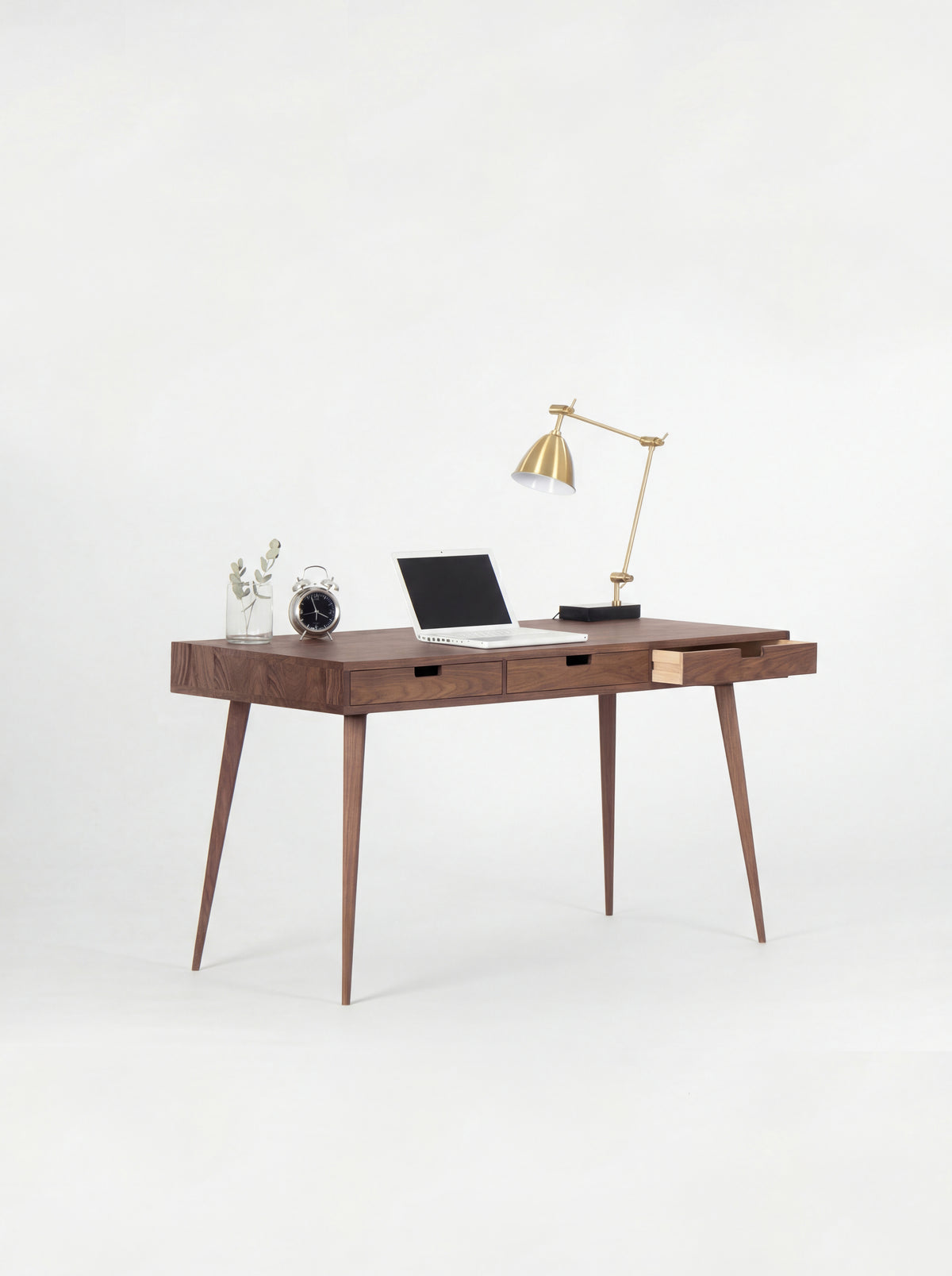 HEIM 140 office desk with drawers in solid walnut, angled view with the right drawer open to show its light plywood side