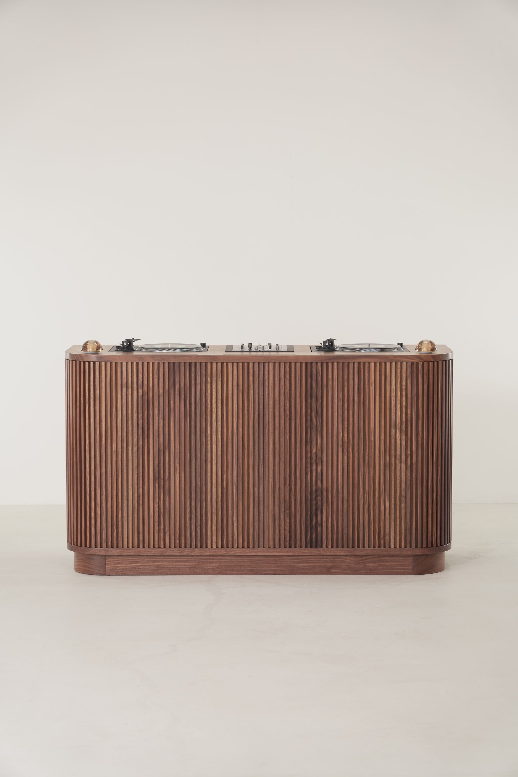 Animation of a rotating solid walnut DJ console featuring turntables and vinyl record storage.