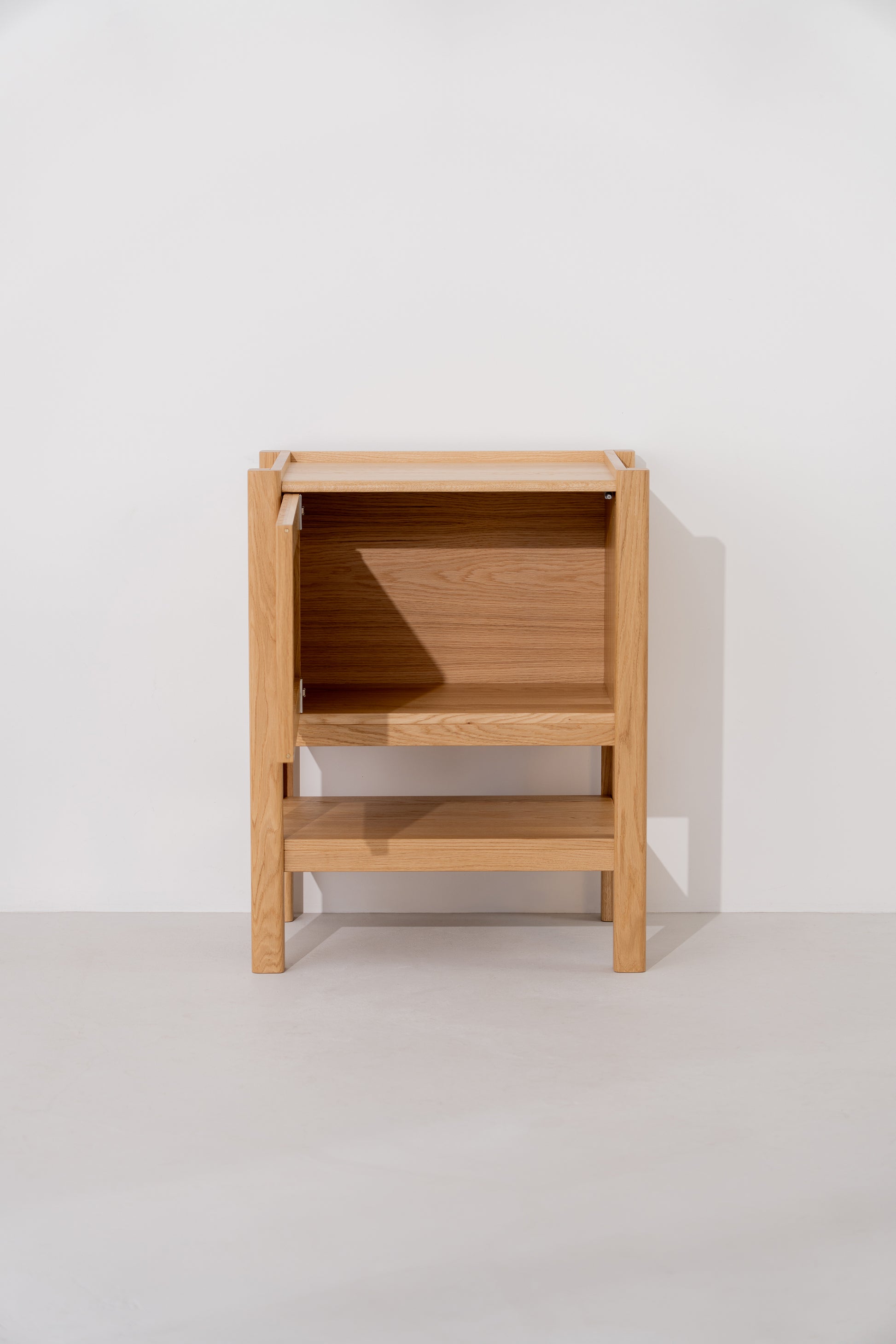 Wooden console table with open storage, against a plain white background.