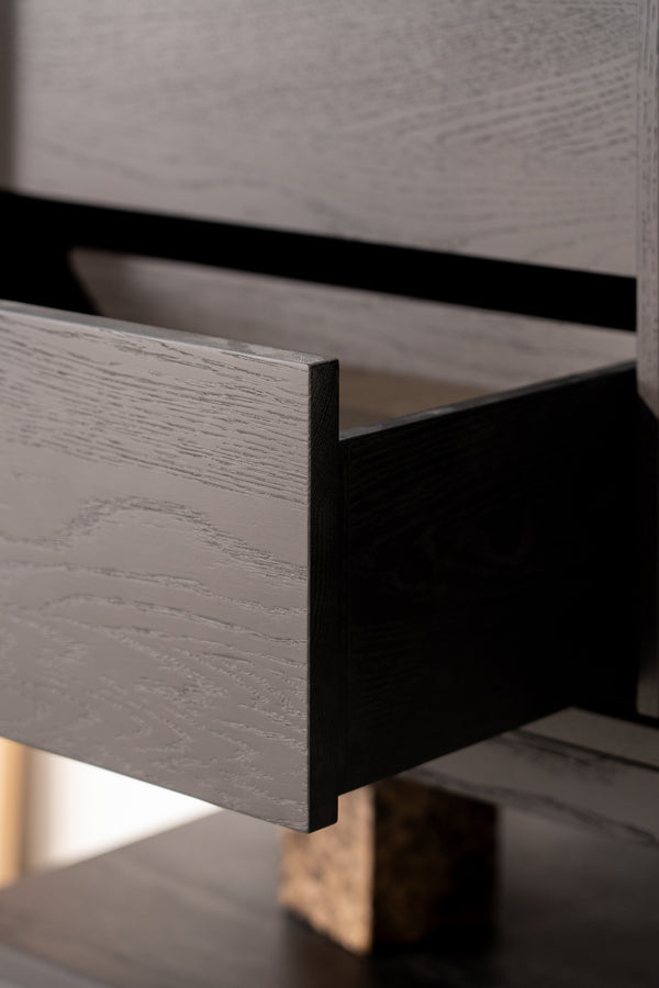 Open wooden drawer with visible wood grain texture.