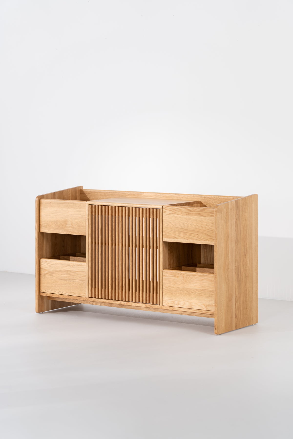 Empty FUSE X in solid oak at a three-quarter angle on a light gray background, with its slatted door closed