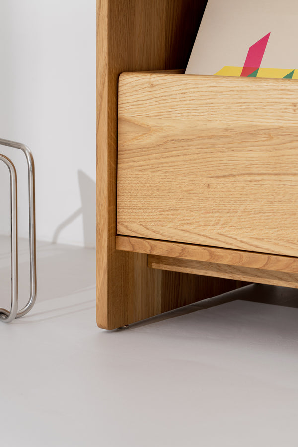 FUSE X in solid oak, side close-up of a closed drawer front below a record niche
