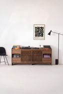 FUSE XX record storage console in solid walnut, front view with closed slatted doors and a turntable on top