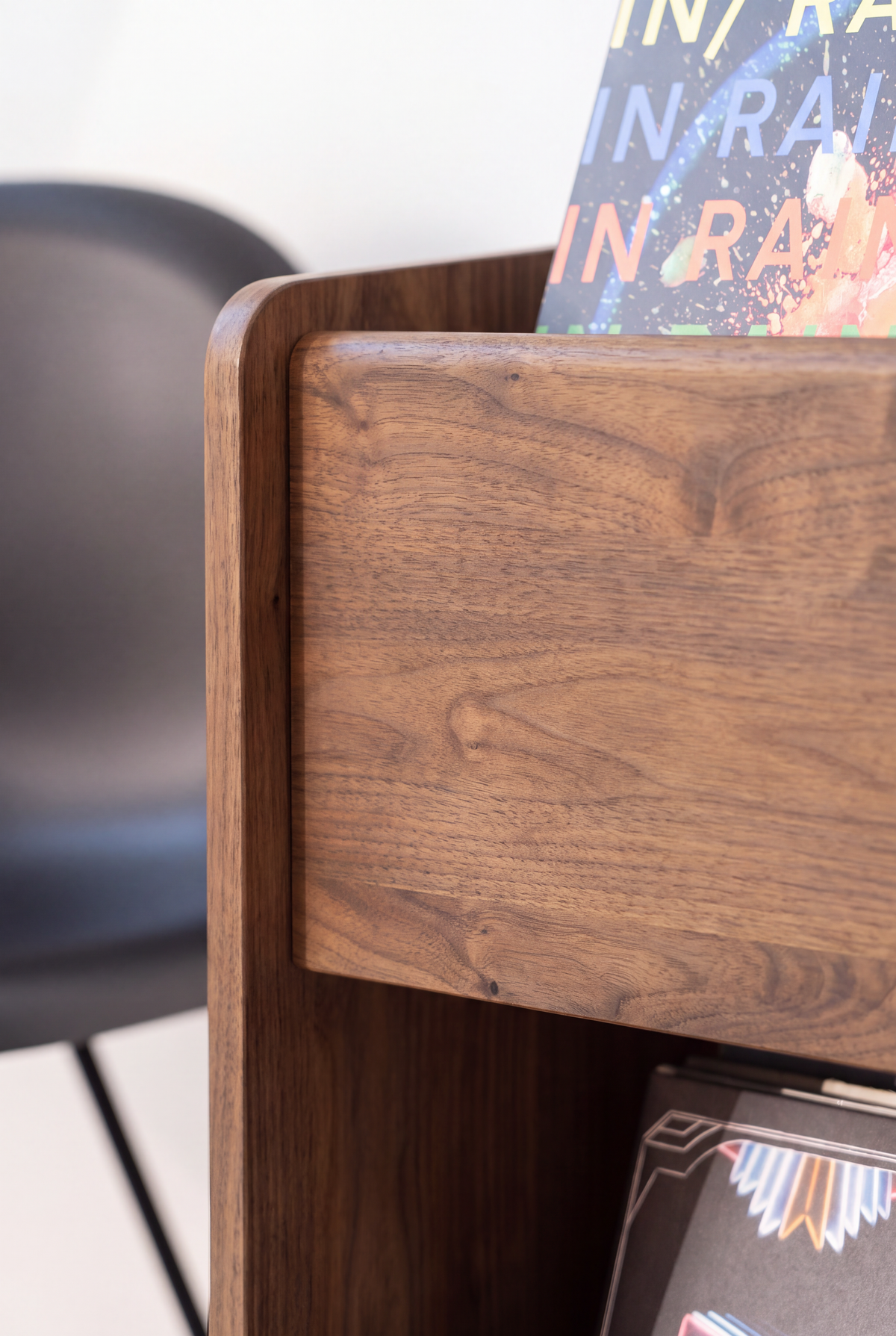 FUSE XX in solid walnut, close-up of the rounded side panel edge and strong grain beside the top niche