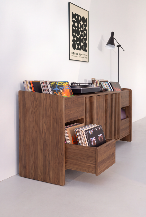 FUSE XX console in solid walnut, end view with a record-filled drawer open and the side panel extending to the floor