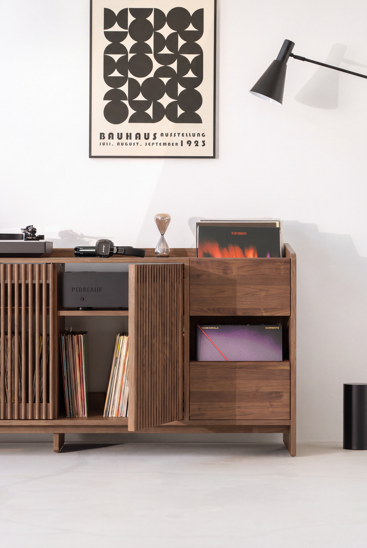 FUSE XX in solid walnut, right section with a slatted door open to reveal an amplifier and records below