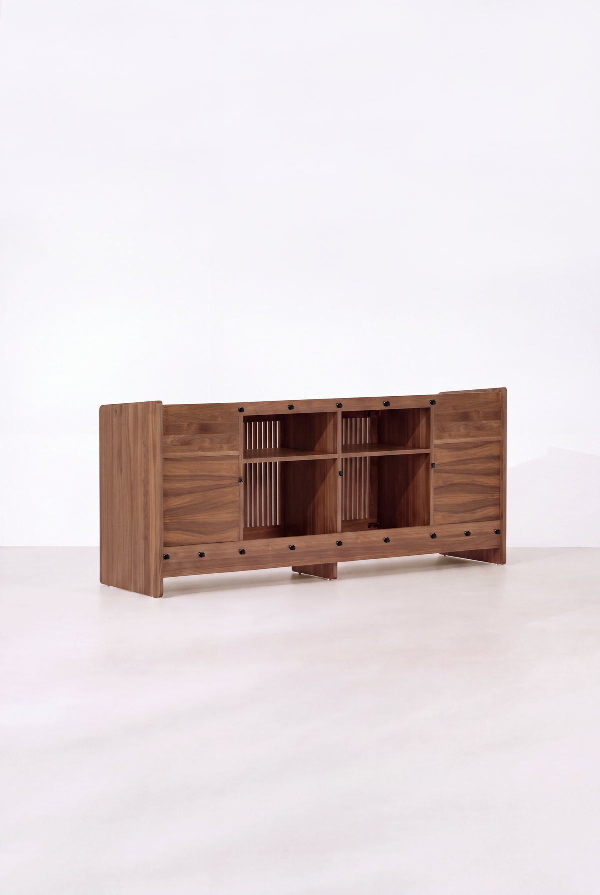 Back of the empty FUSE XX in solid walnut, with two open center compartments, shelves and black fasteners