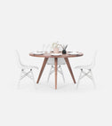 OKKO round dining table in solid American walnut set with tableware, three white chairs around it