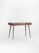 HEIM 105 desk in walnut wood with a bare top and two wooden drawer fronts, shown at an angle