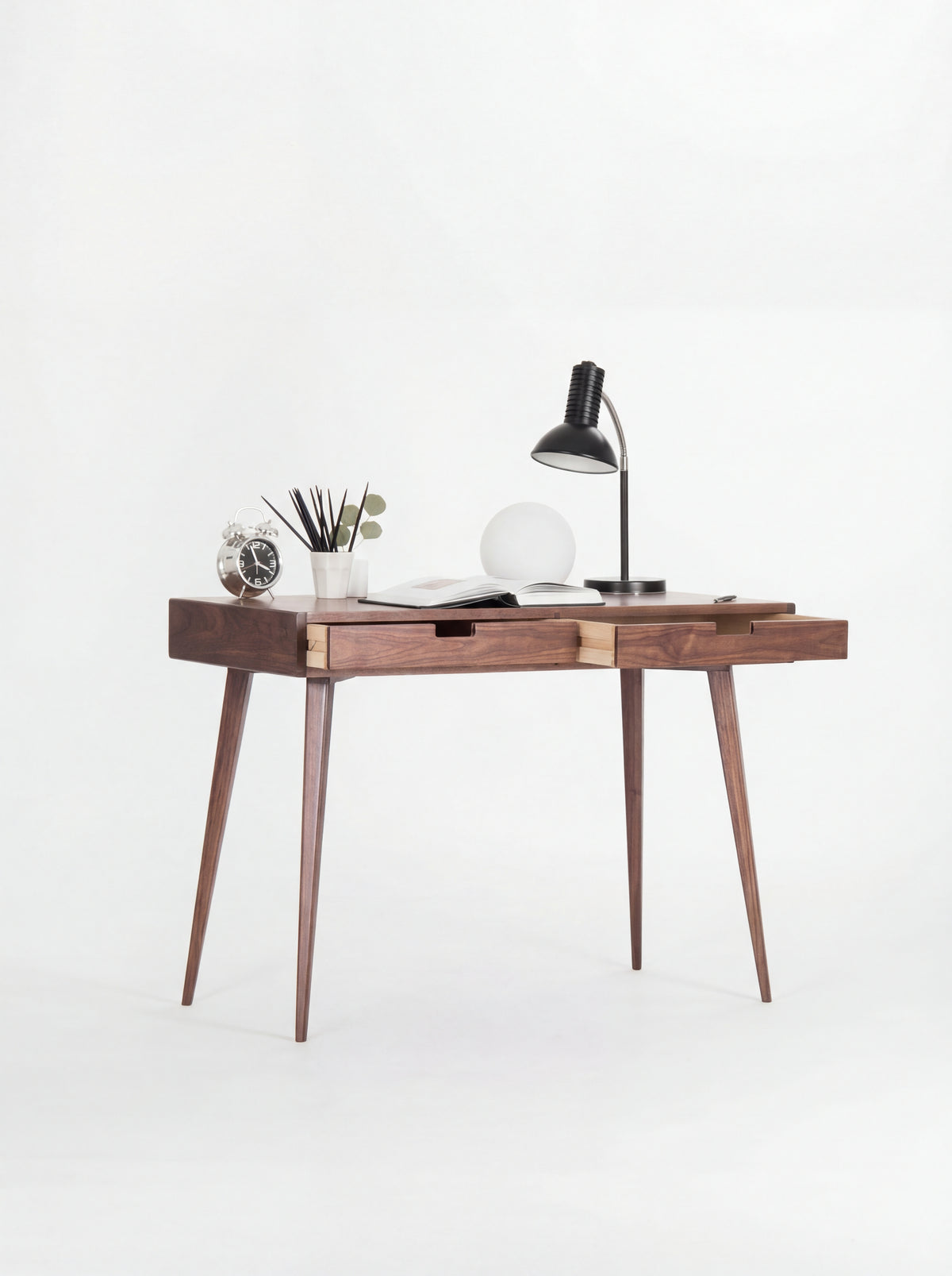 HEIM 105 desk in walnut wood with both drawers slightly open, revealing light plywood sides