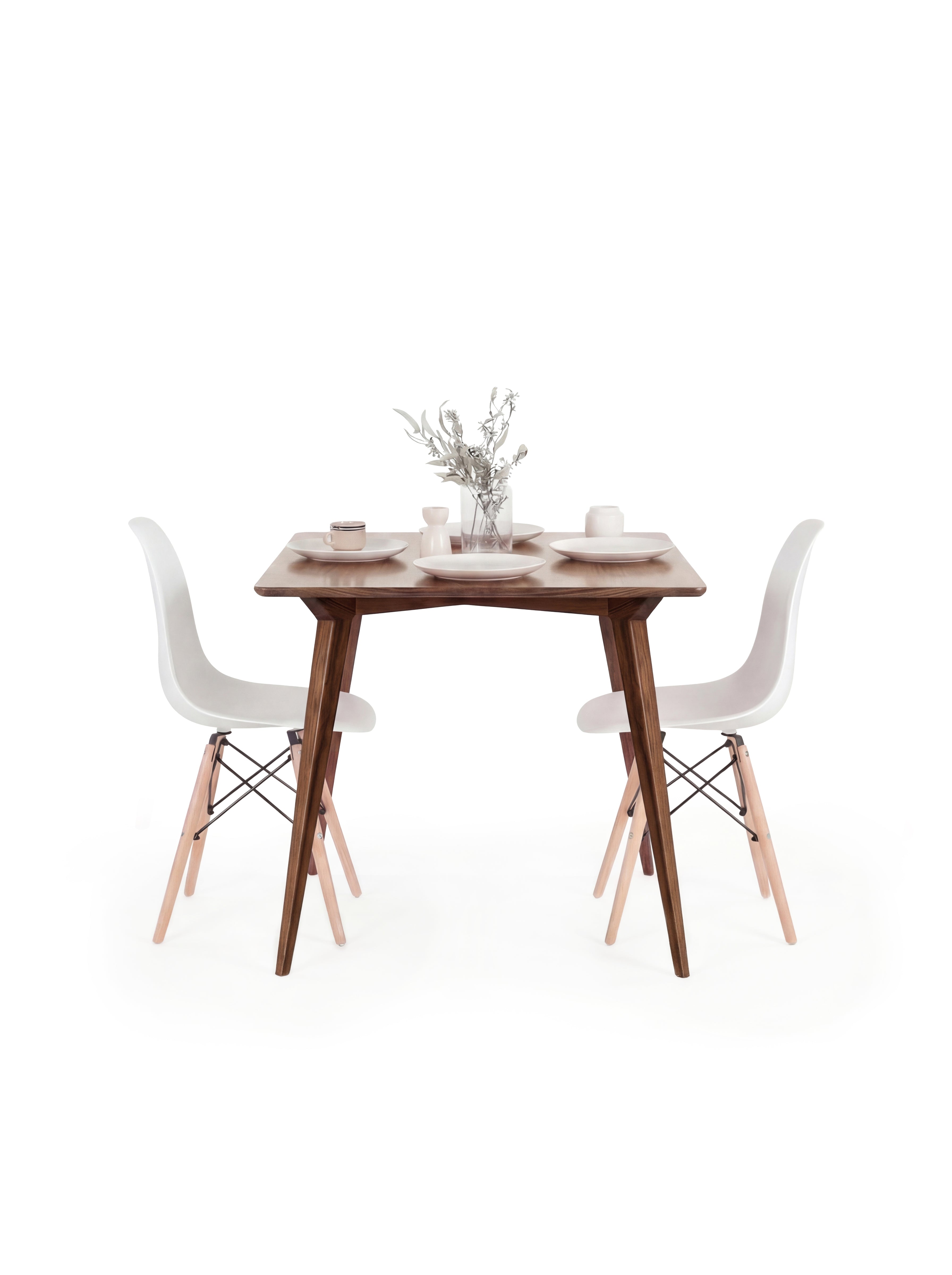  Wooden table with white chairs, small vase with flowers, and minimal decor on top.