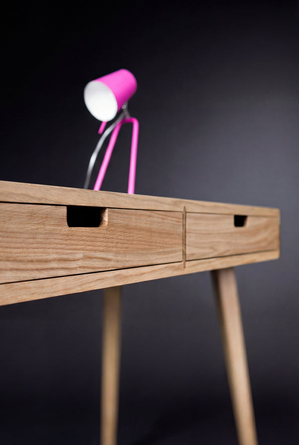 HEIM 105 desk in oak wood, close-up of two drawer fronts with rectangular cutout grips and a leg below