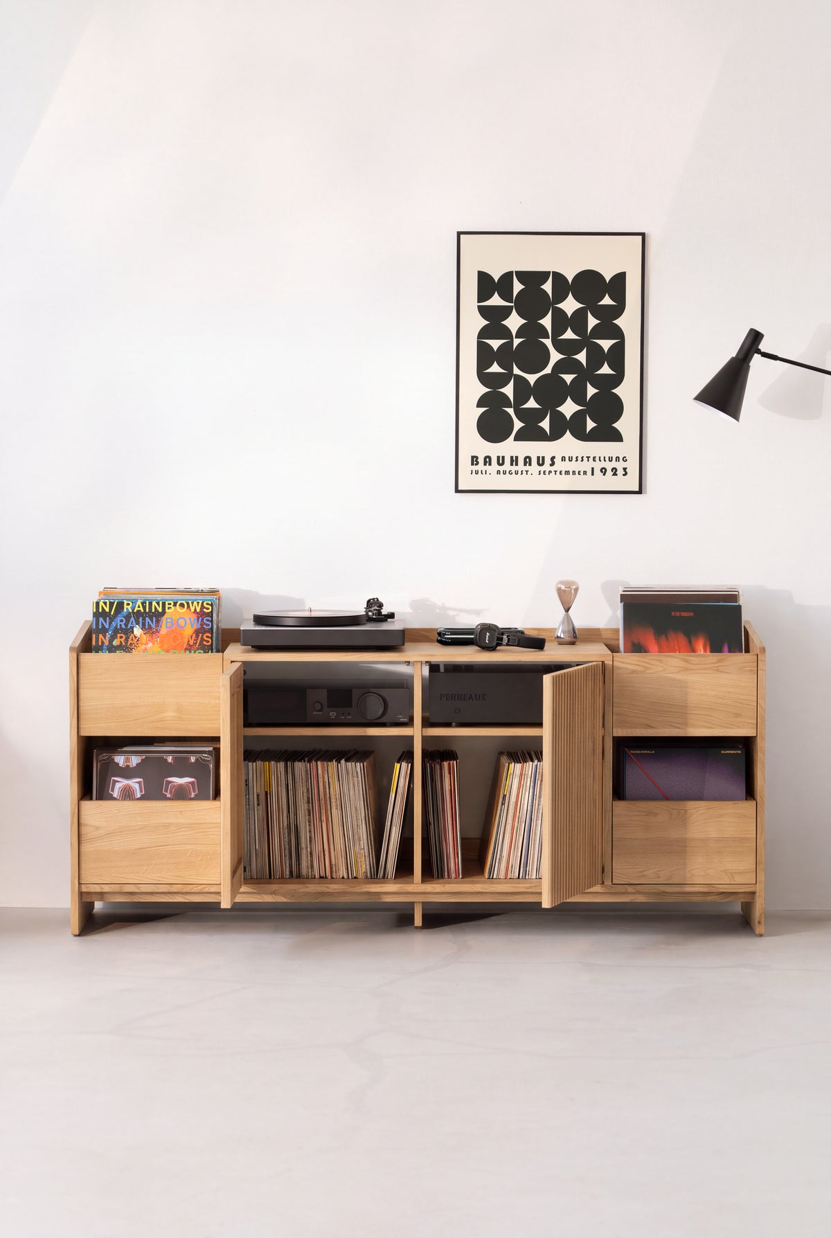 Solid oak FUSE XX vinyl record storage cabinet with doors open, revealing an amplifier and records
