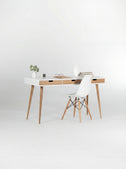 HEIM 140 white desk with drawers in oak wood, angled view with natural oak fronts and a white shell chair